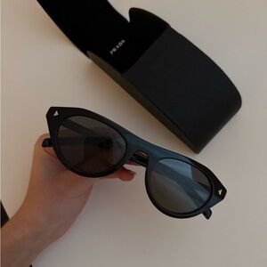 PRADA black sunglasses with metal plague